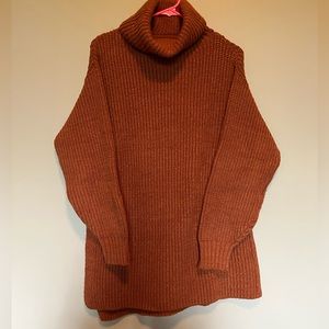 Lightly worn burnt orange free people turtle neck sweater!